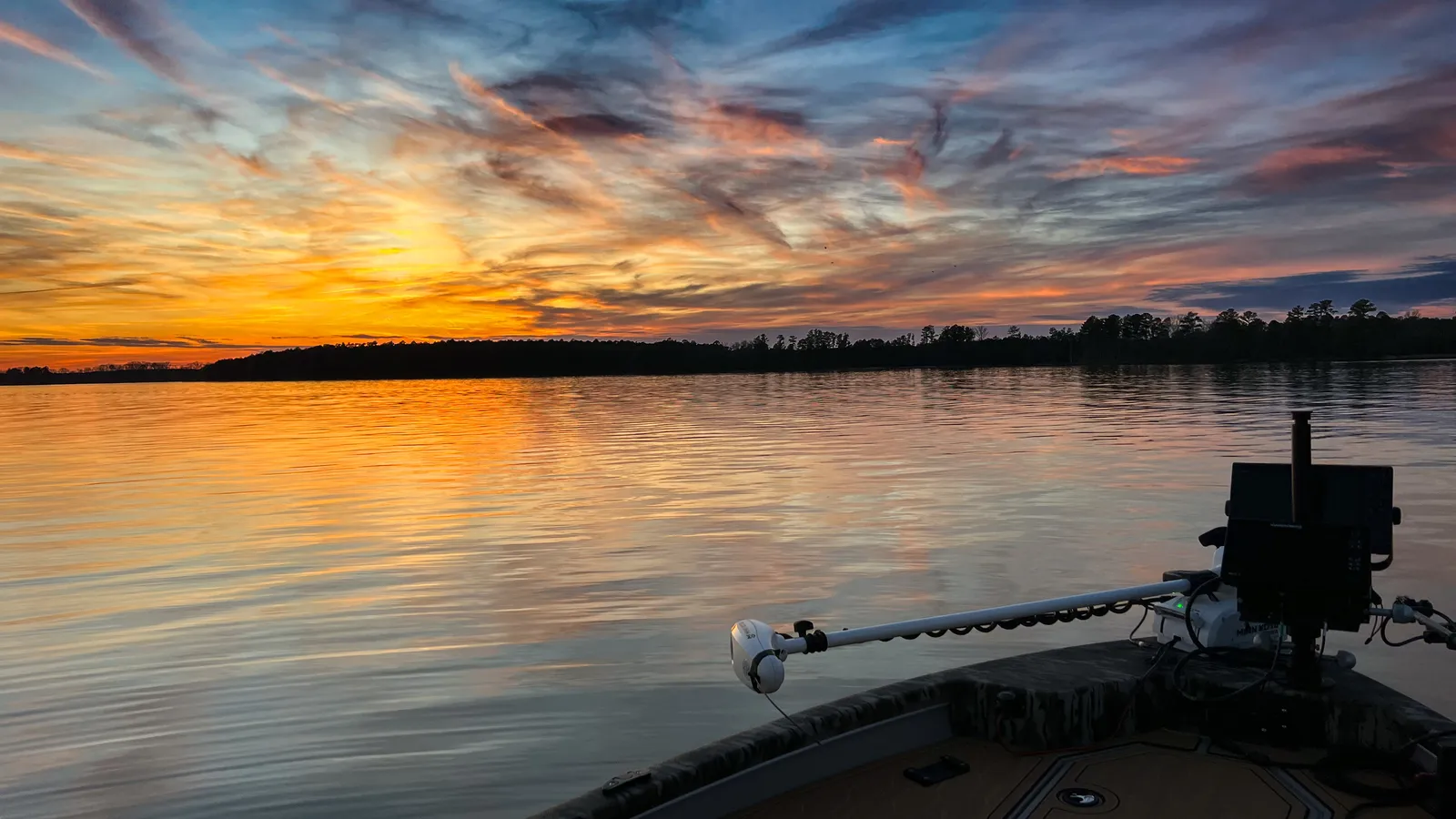Sunset over an NC lake from the deck of a boat